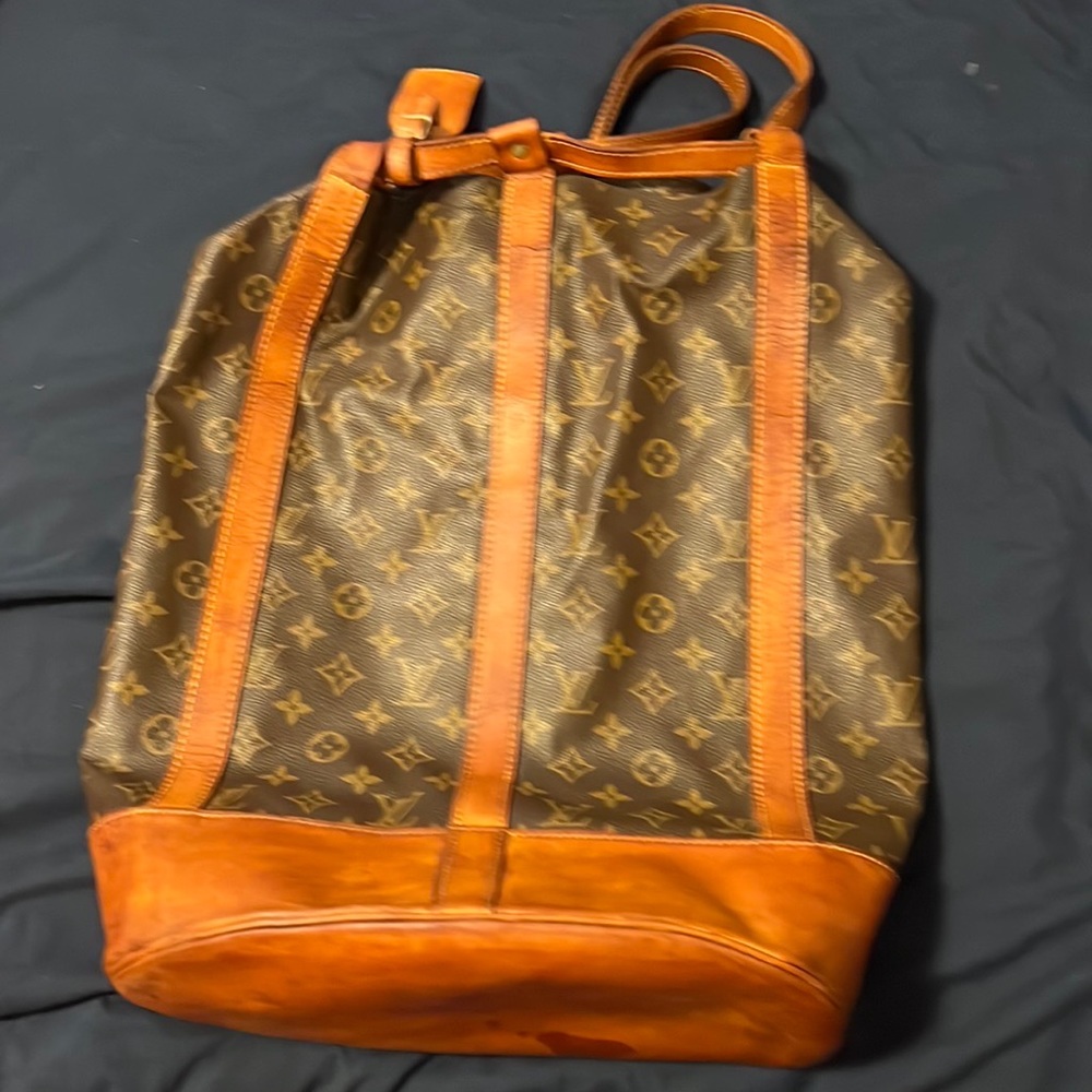 Authentic vintage Louis Vuitton duffel style backpack.